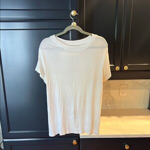 Classic white t shirt, super flattering fit and great quality, with small stain